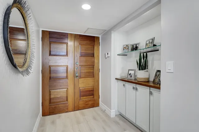 a view of a hallway with entryway