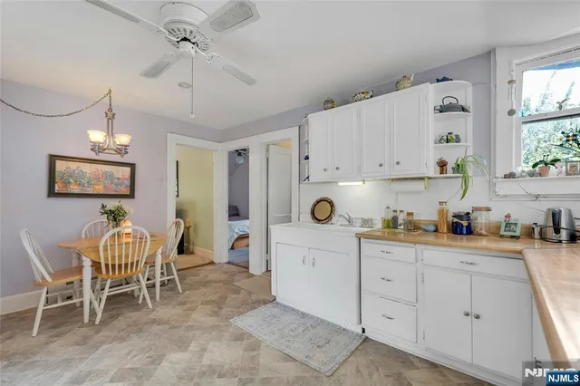 a kitchen with a cabinets and window