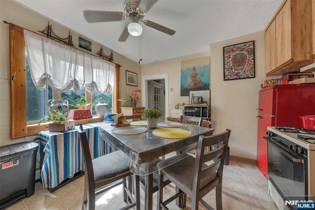 a view of a dining room with furniture window and outside view