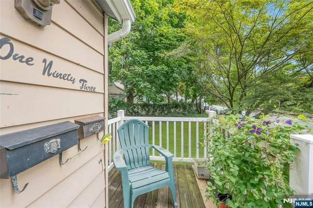 a view of a chair and table in the balcony