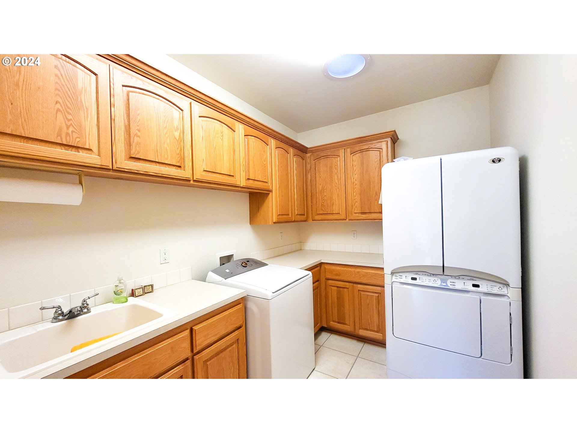 33825 Cea Jac Road Creswell, OR 97426 - Photo 24 of 48 a kitchen with stainless steel appliances a refrigerator a sink and cabinets