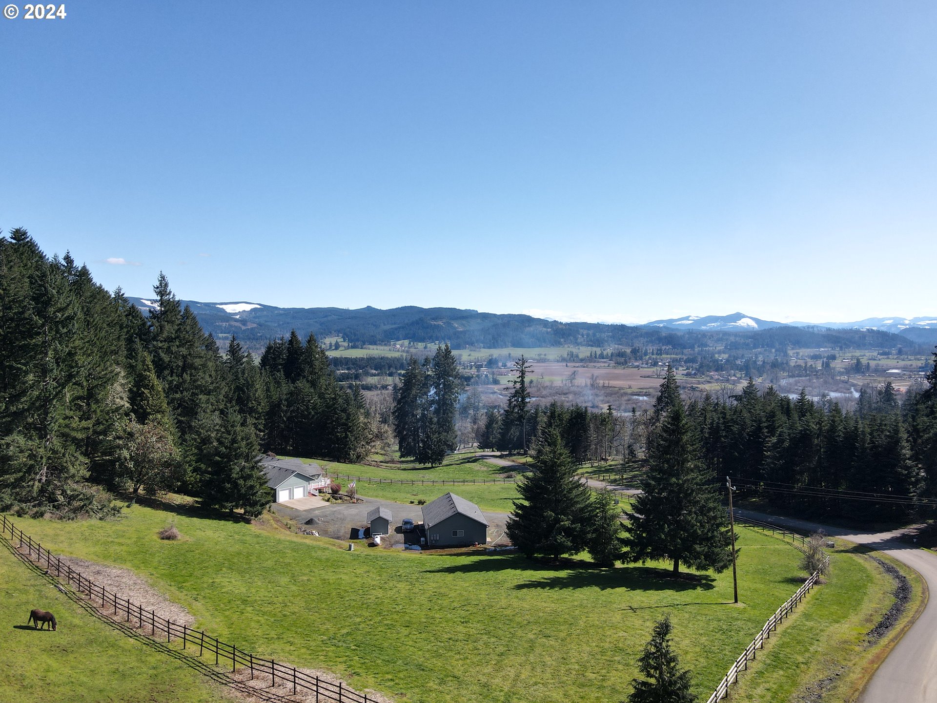 33825 Cea Jac Road Creswell, OR 97426 - Photo 3 of 48 a view of a lush green field with mountains in the background