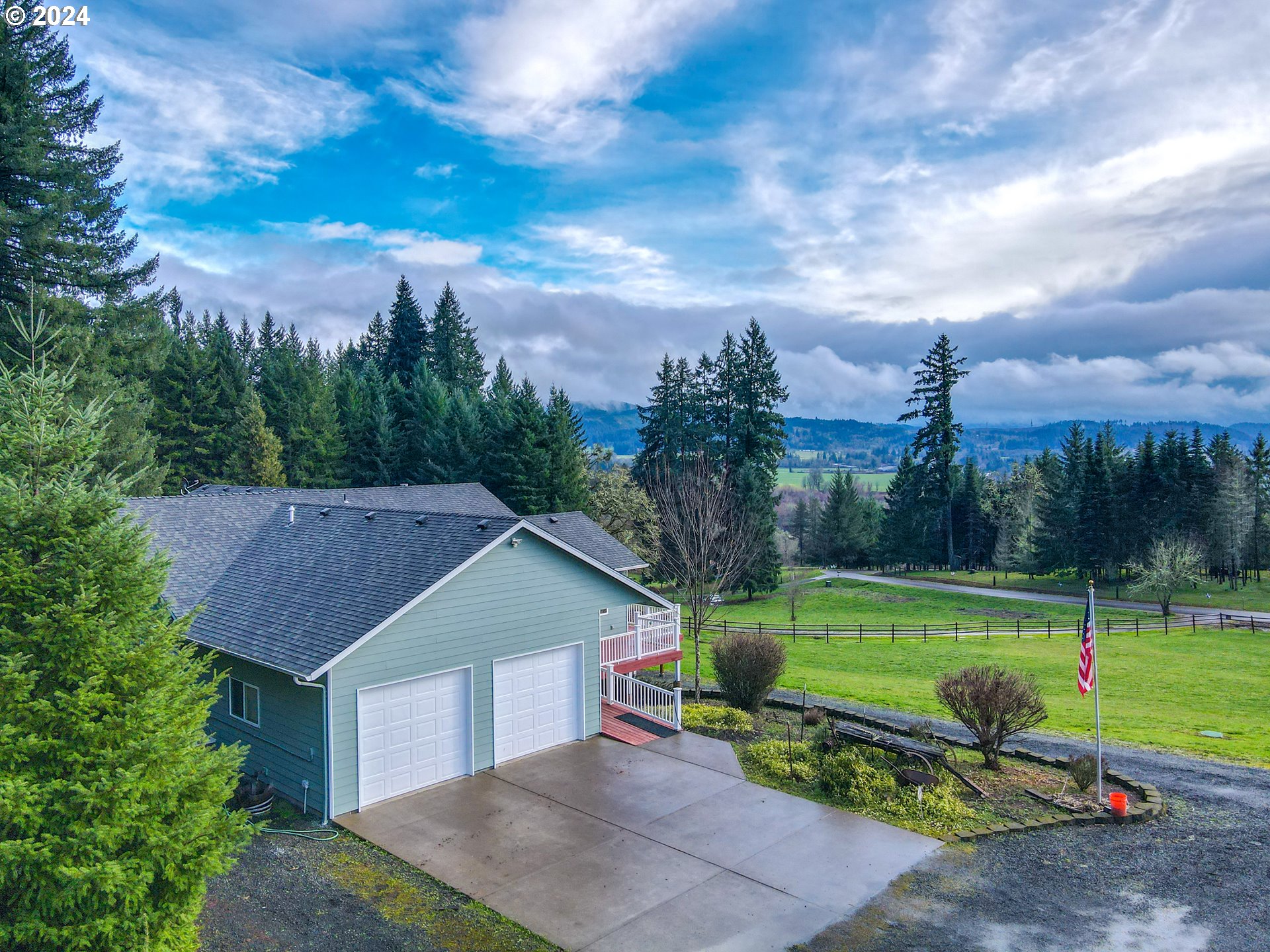 33825 Cea Jac Road Creswell, OR 97426 - Photo 42 of 48 a view of a house with a yard and a garden