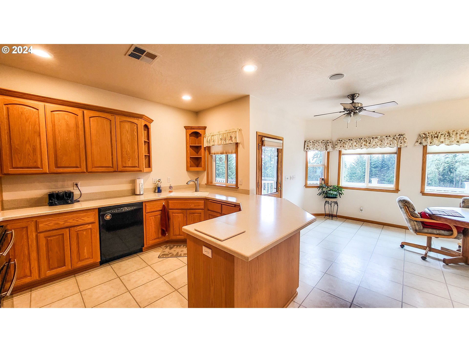 33825 Cea Jac Road Creswell, OR 97426 - Photo 6 of 48 a open kitchen with sink refrigerator and cabinets