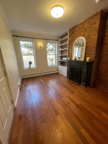 a view of a livingroom with wooden floor