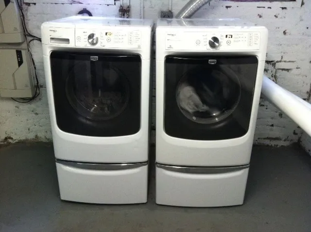 a utility room with washer and dryer