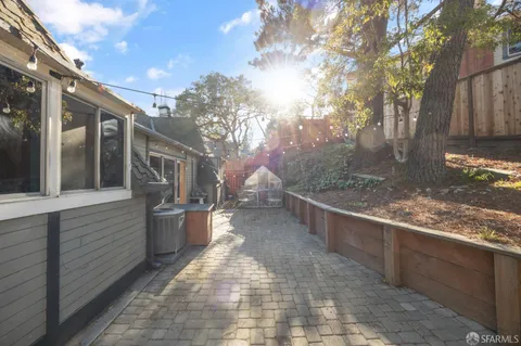a view of a backyard with large trees