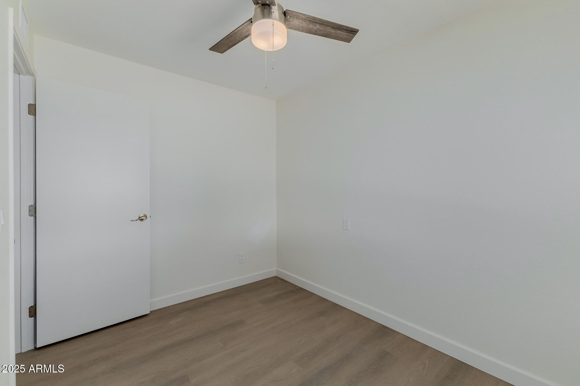 936 West Rio Salado Parkway, Unit 3 Mesa, AZ 85201 - Photo 20 of 26 a view of a small space with wooden floor and a window