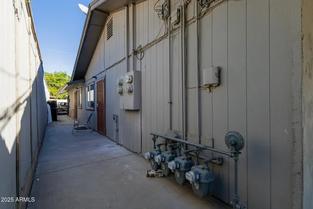 a view of a hallway with wooden shelves