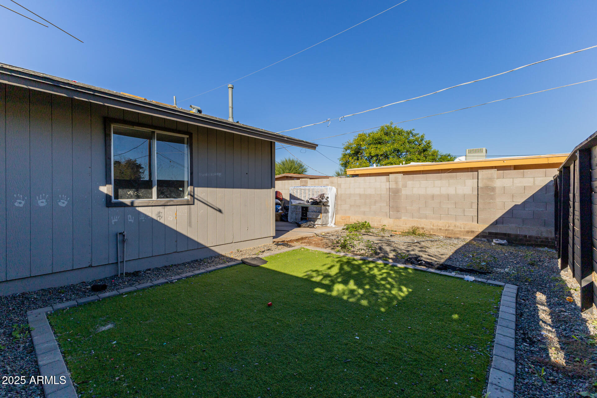 936 West Rio Salado Parkway, Unit 3 Mesa, AZ 85201 - Photo 26 of 26 a backyard of a house with lots of green space