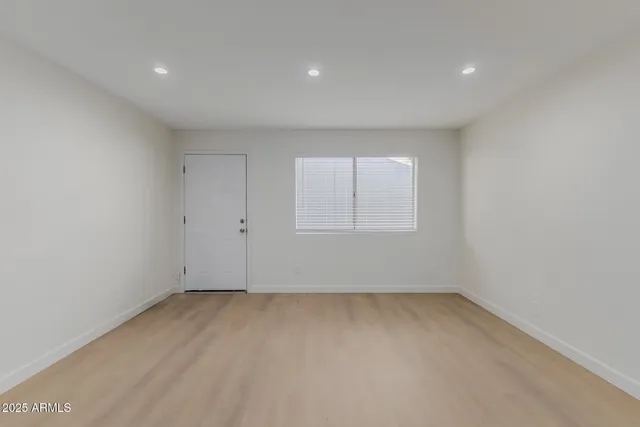 an empty room with a empty space and window