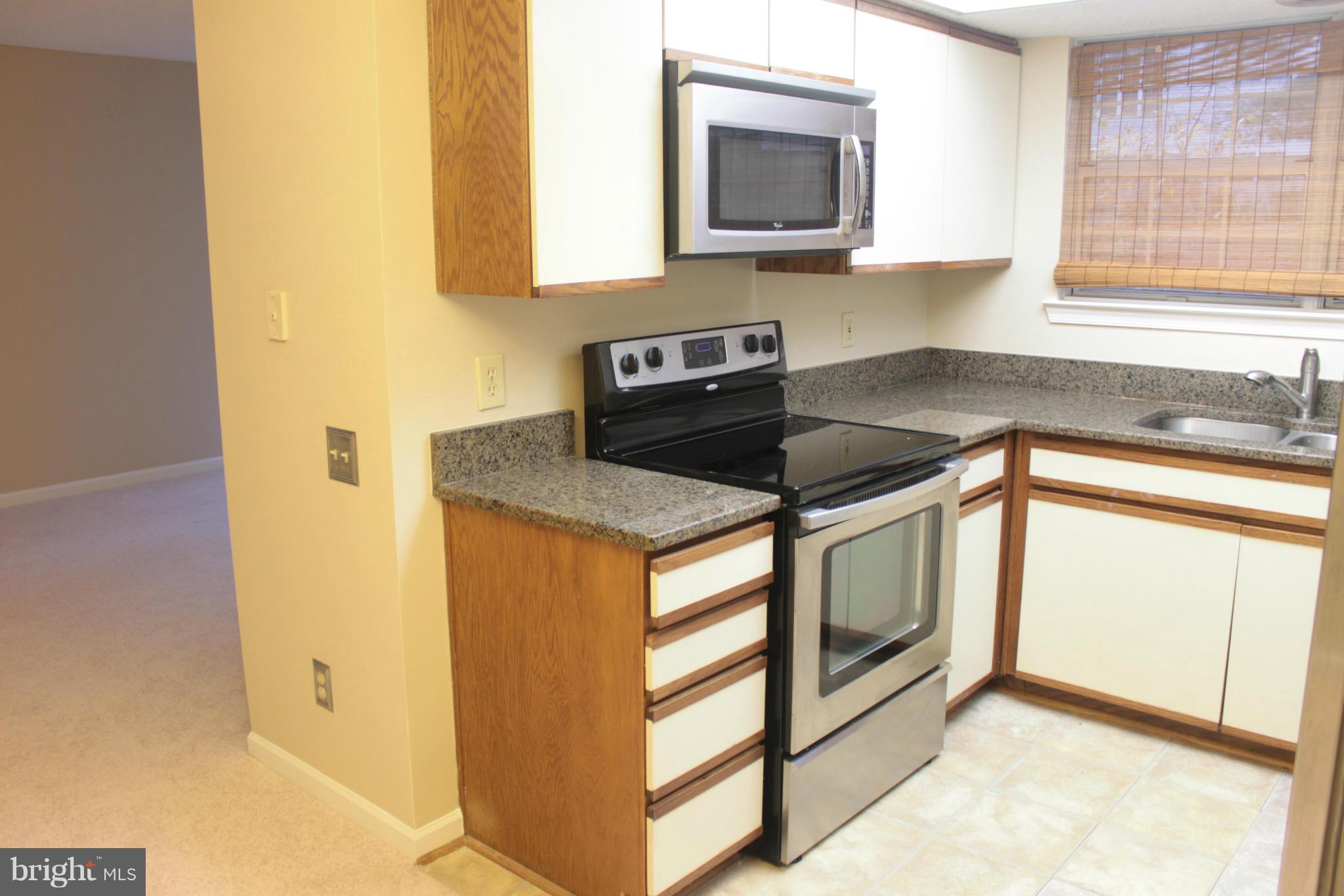 12003 Golf Ridge Court, Unit 102 Fairfax, VA 22033 - Photo 3 of 21 Built-in Microwave and Granite Counter Tops