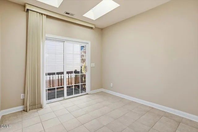 a view of empty room with windows