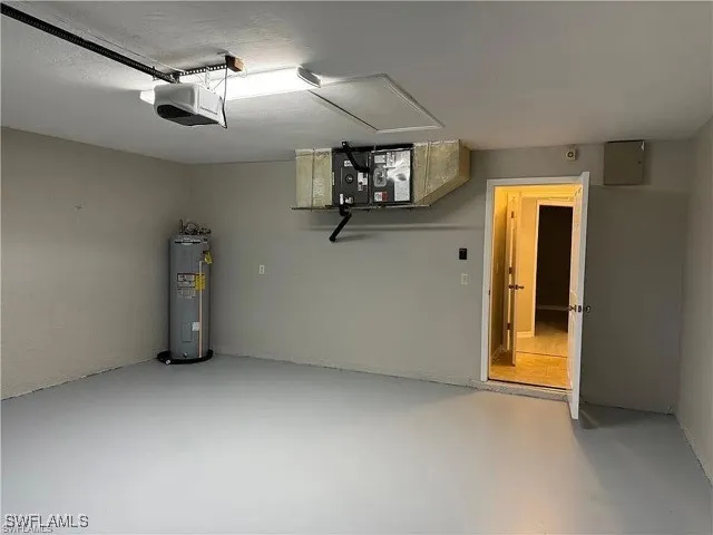 en empty room with ceiling fan and wooden floor