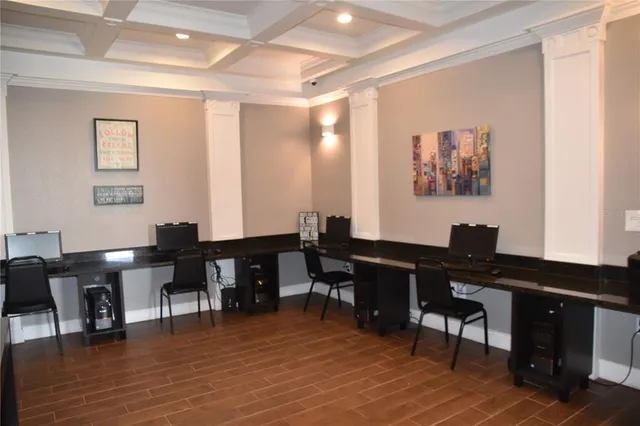 a media room with furniture a rug and a projector