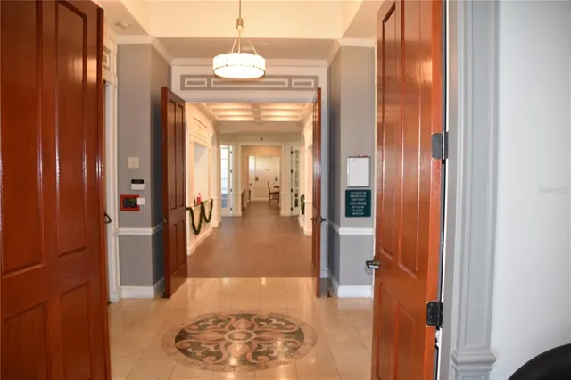 a view of a building with a yard and plants