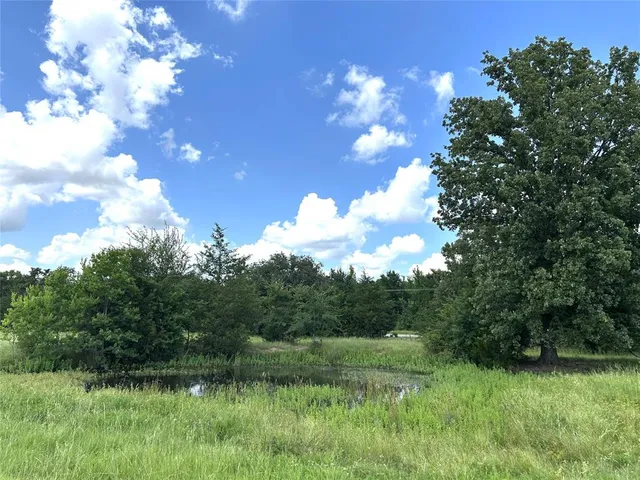 a view of lake with green space