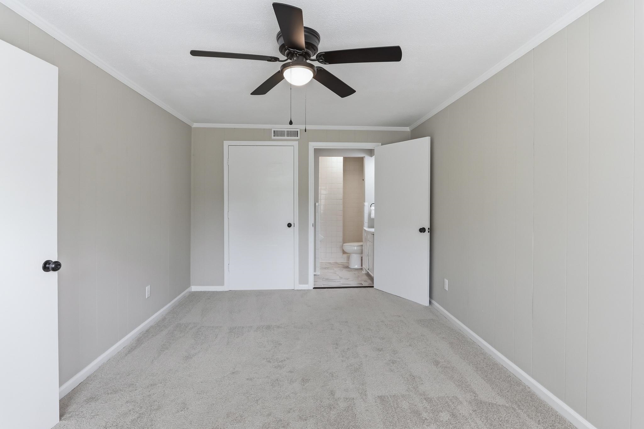 312 Fernway Road Memphis, TN 38117 - Photo 7 of 38 Unfurnished bedroom featuring light carpet, ornamental molding, and ceiling fan