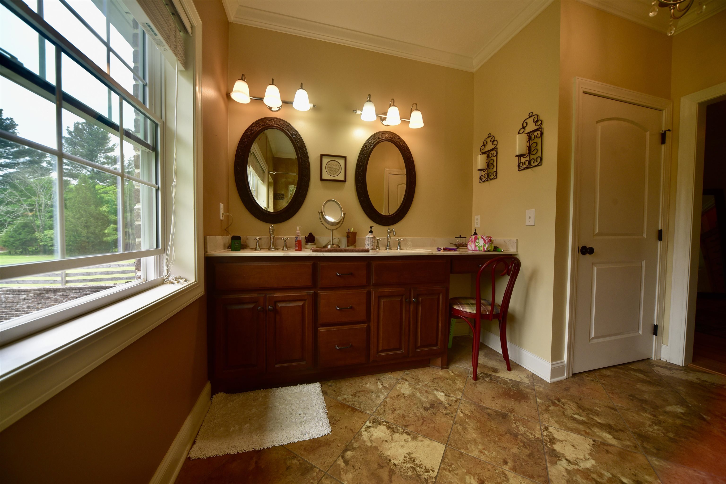 1359 Macks Grove Road Palmersville, TN 38241 - Photo 15 of 40 Full bath with baseboards, ornamental molding, stone tile flooring, and double vanity