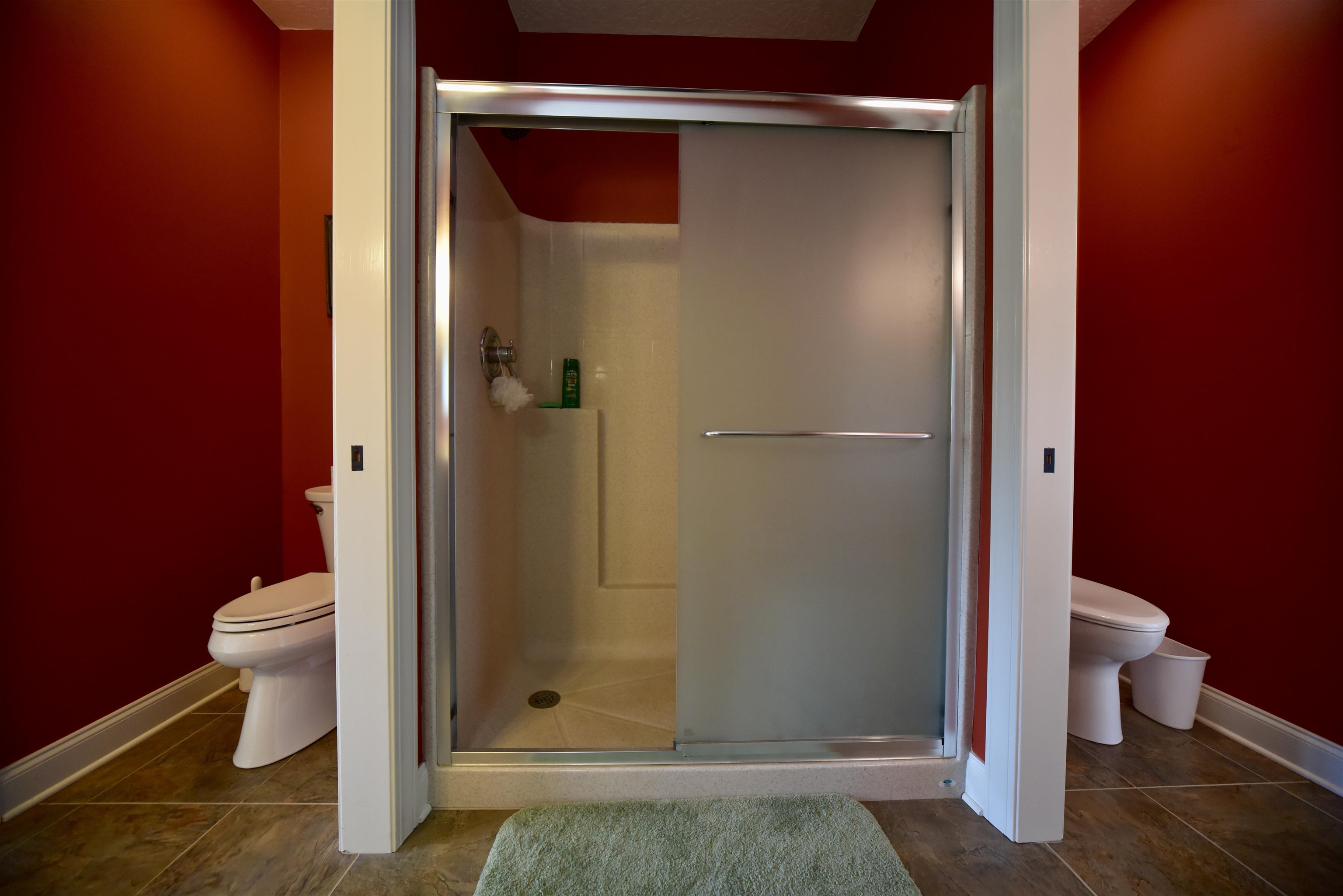 1359 Macks Grove Road Palmersville, TN 38241 - Photo 17 of 40 Bathroom featuring toilet, a shower stall, baseboards, and tile patterned floors