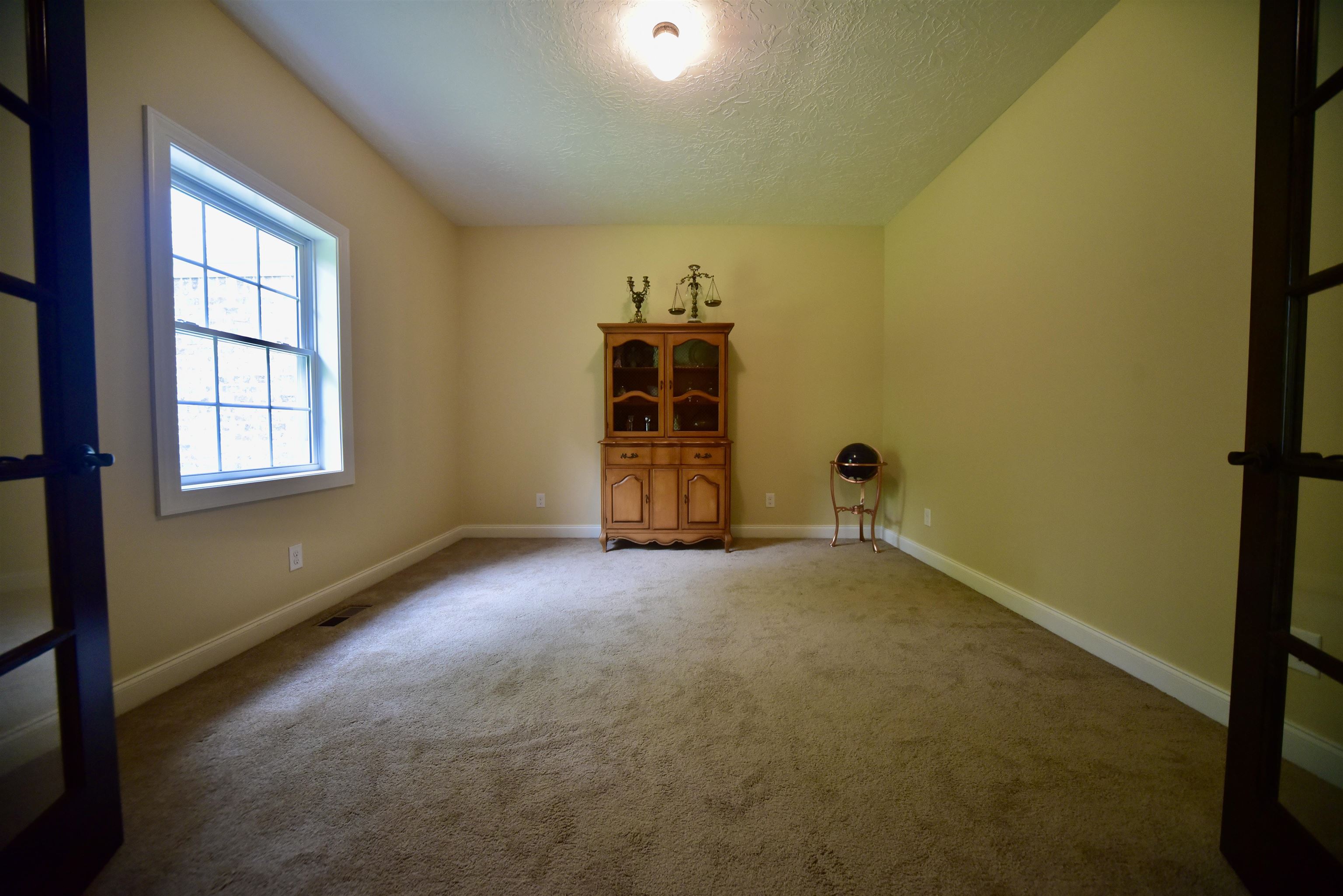 1359 Macks Grove Road Palmersville, TN 38241 - Photo 20 of 40 Spare room with a textured ceiling, carpet flooring, and baseboards