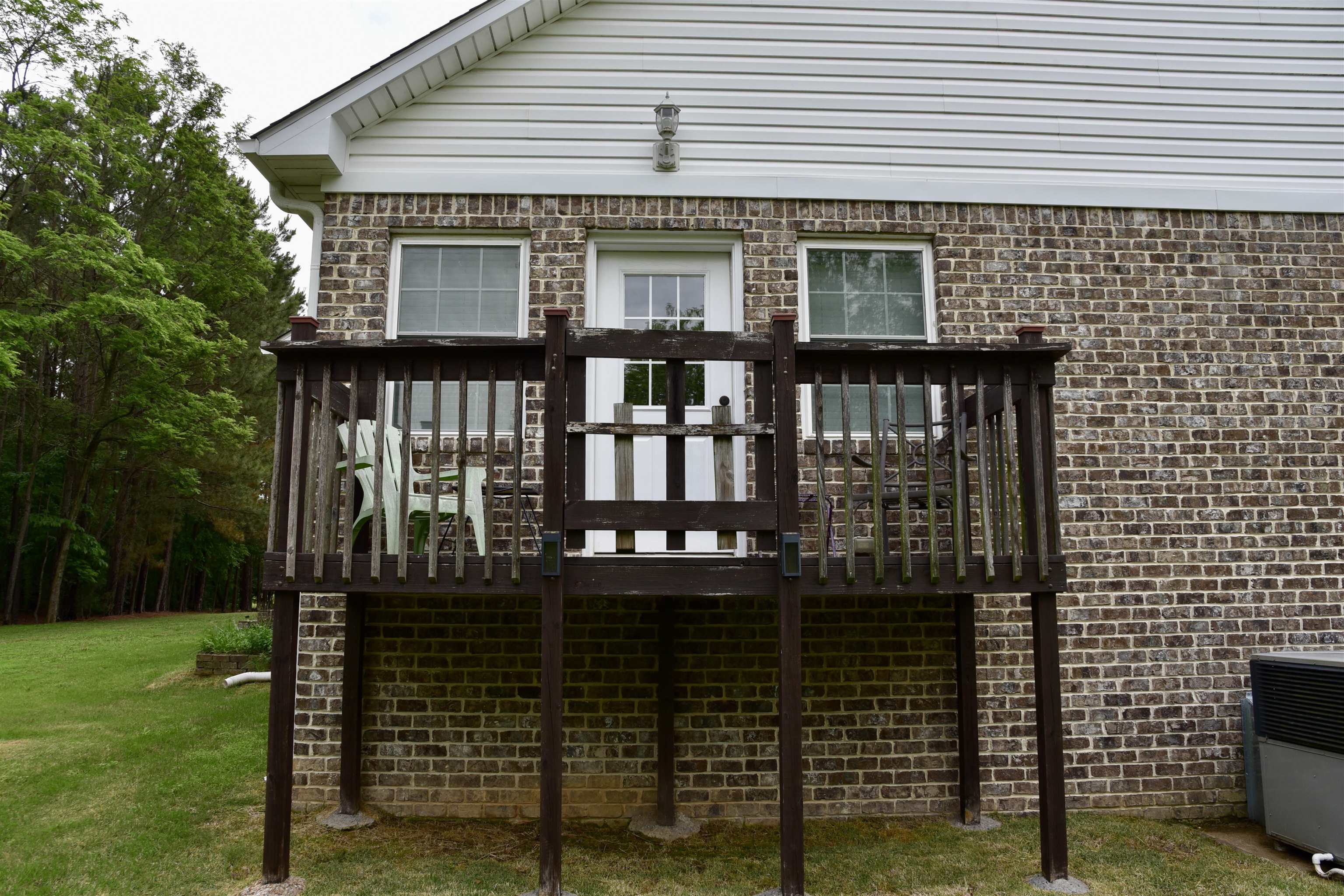 1359 Macks Grove Road Palmersville, TN 38241 - Photo 25 of 40 Rear view of house featuring a wooden deck, a yard, and brick siding