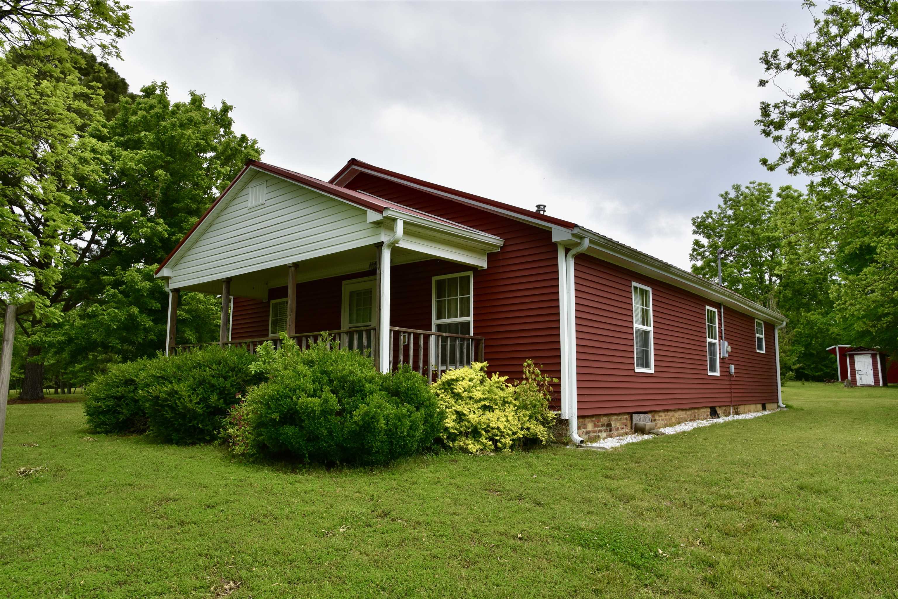 1359 Macks Grove Road Palmersville, TN 38241 - Photo 27 of 40 View of front of house with a front lawn and covered porch