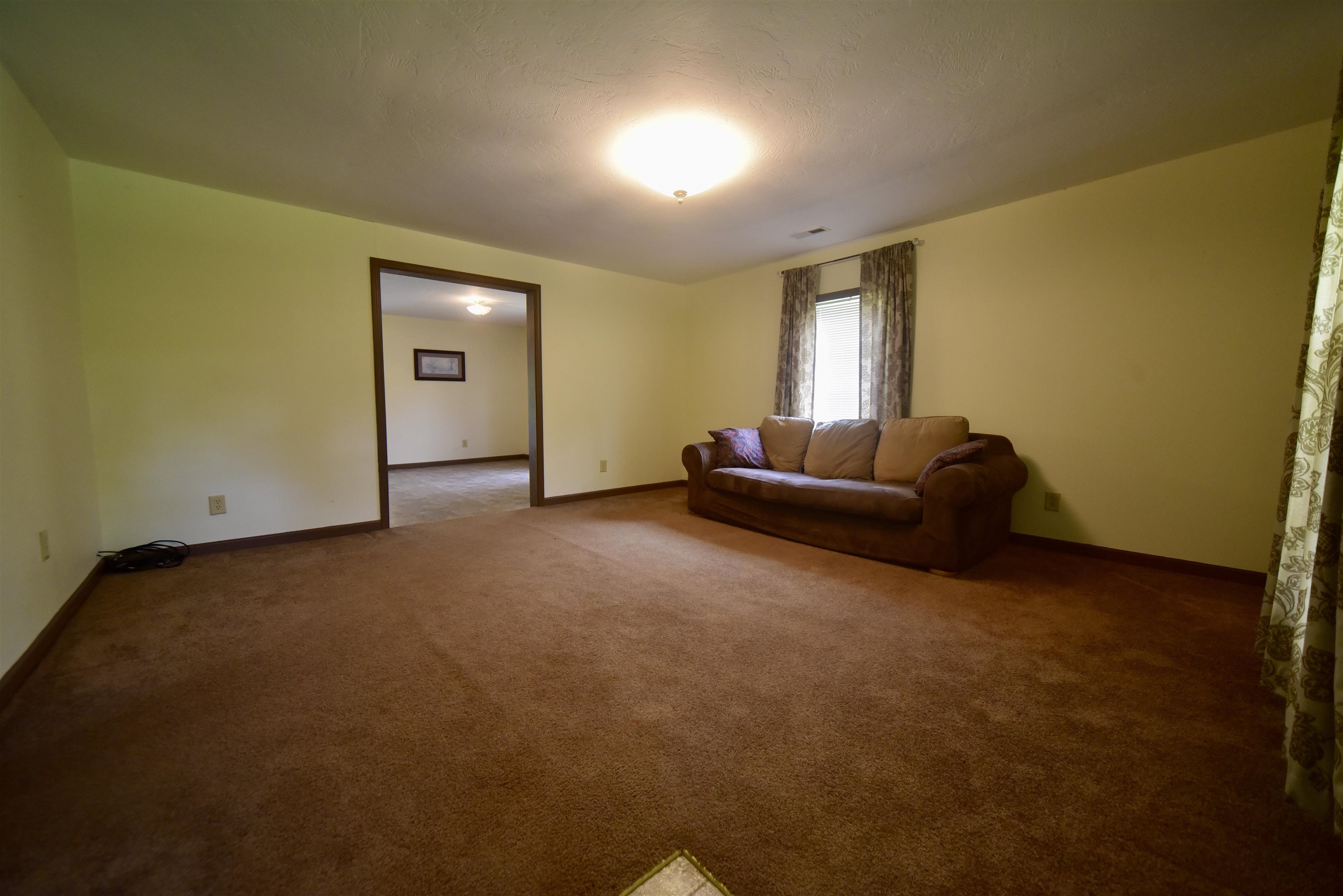 1359 Macks Grove Road Palmersville, TN 38241 - Photo 30 of 40 Living room with baseboards and carpet floors