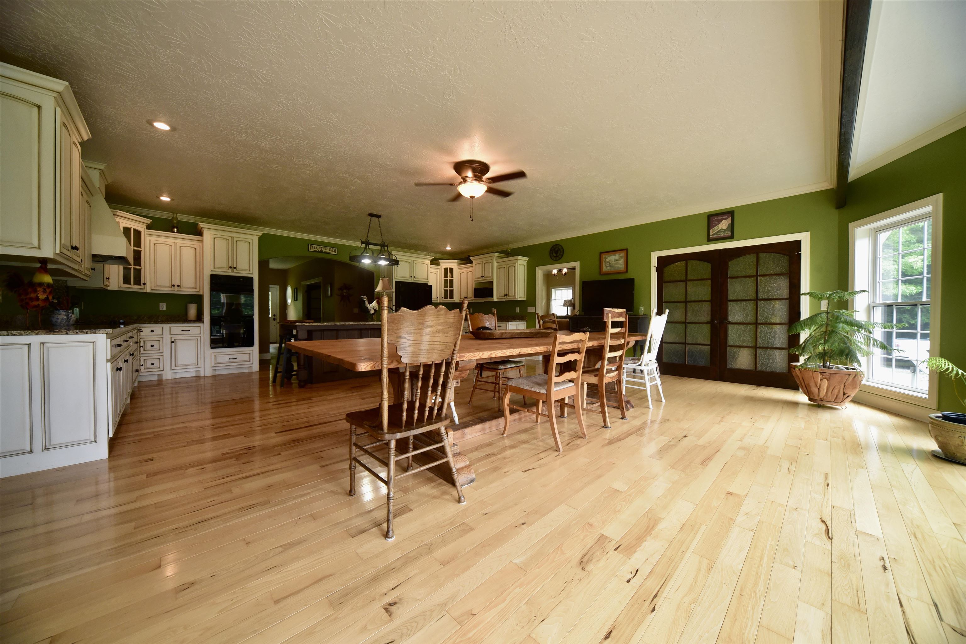 1359 Macks Grove Road Palmersville, TN 38241 - Photo 9 of 40 Dining area with ceiling fan, light wood-style flooring, and a textured ceiling