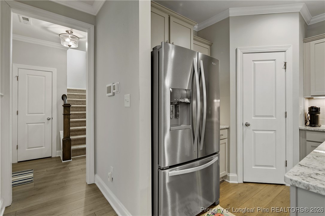 88 Spruce Hollow Circle Spring Lake, NC 28390 - Photo 12 of 48 a metallic refrigerator freezer sitting in a kitchen