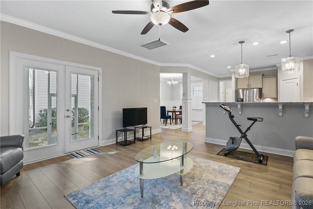 88 Spruce Hollow Circle Spring Lake, NC 28390 - Photo 23 of 48 a living room with furniture a flat screen tv and kitchen view