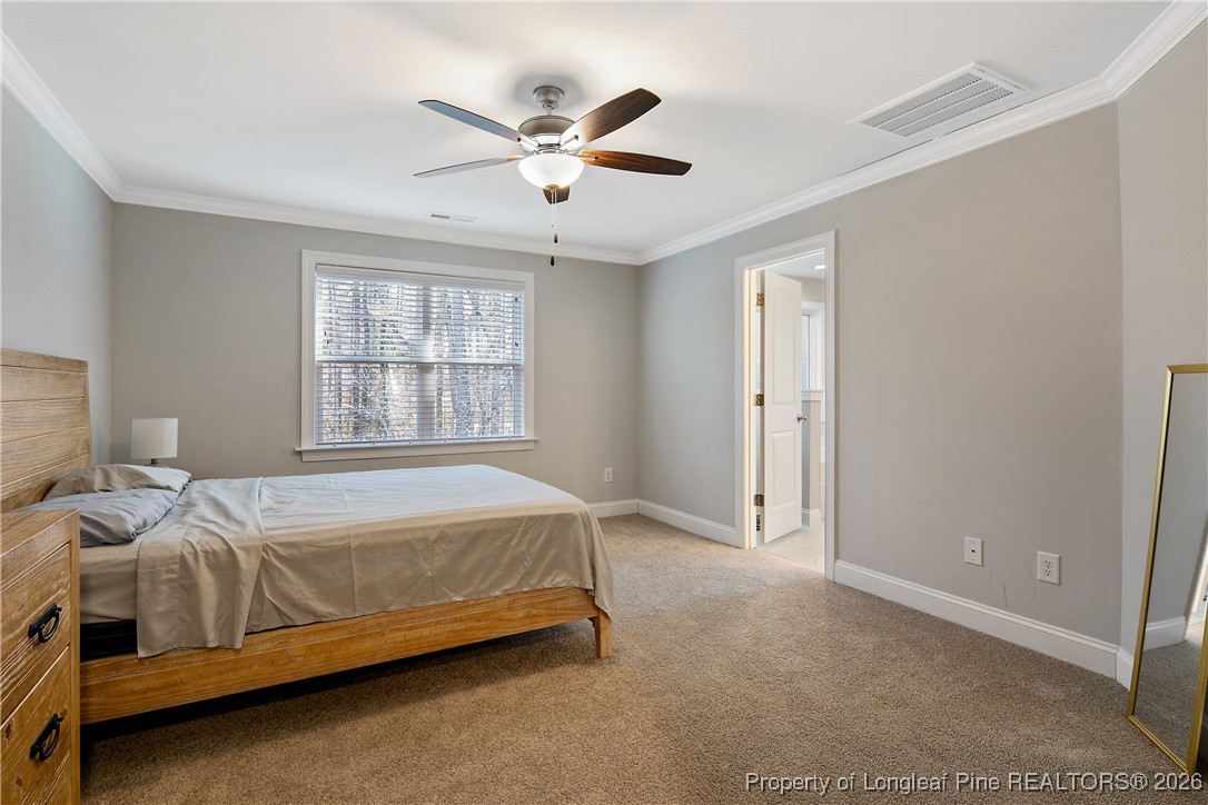 88 Spruce Hollow Circle Spring Lake, NC 28390 - Photo 26 of 48 a bedroom with a bed and window