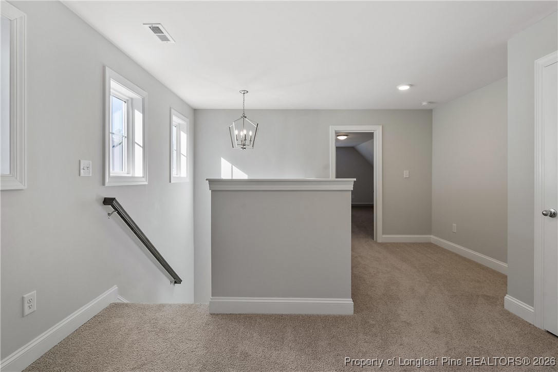 88 Spruce Hollow Circle Spring Lake, NC 28390 - Photo 34 of 48 wooden floor in an empty room with a window