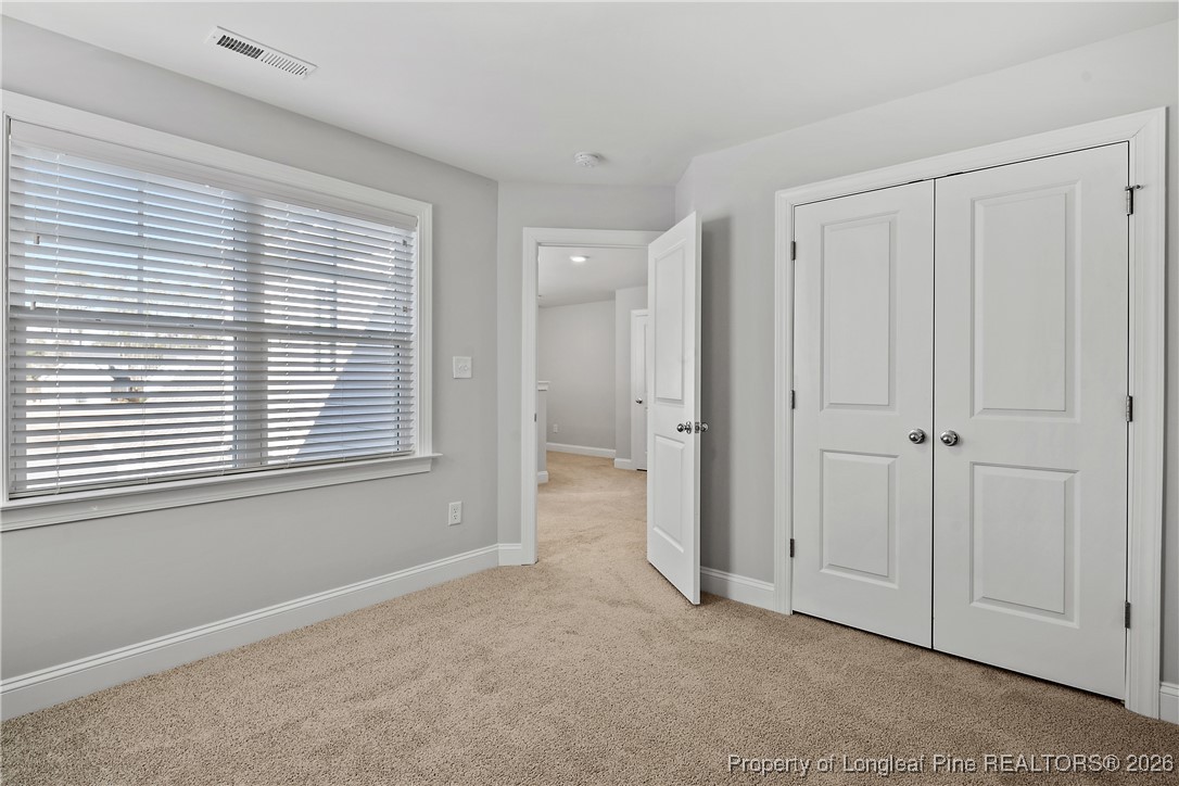 88 Spruce Hollow Circle Spring Lake, NC 28390 - Photo 39 of 48 a view of an empty room with a window