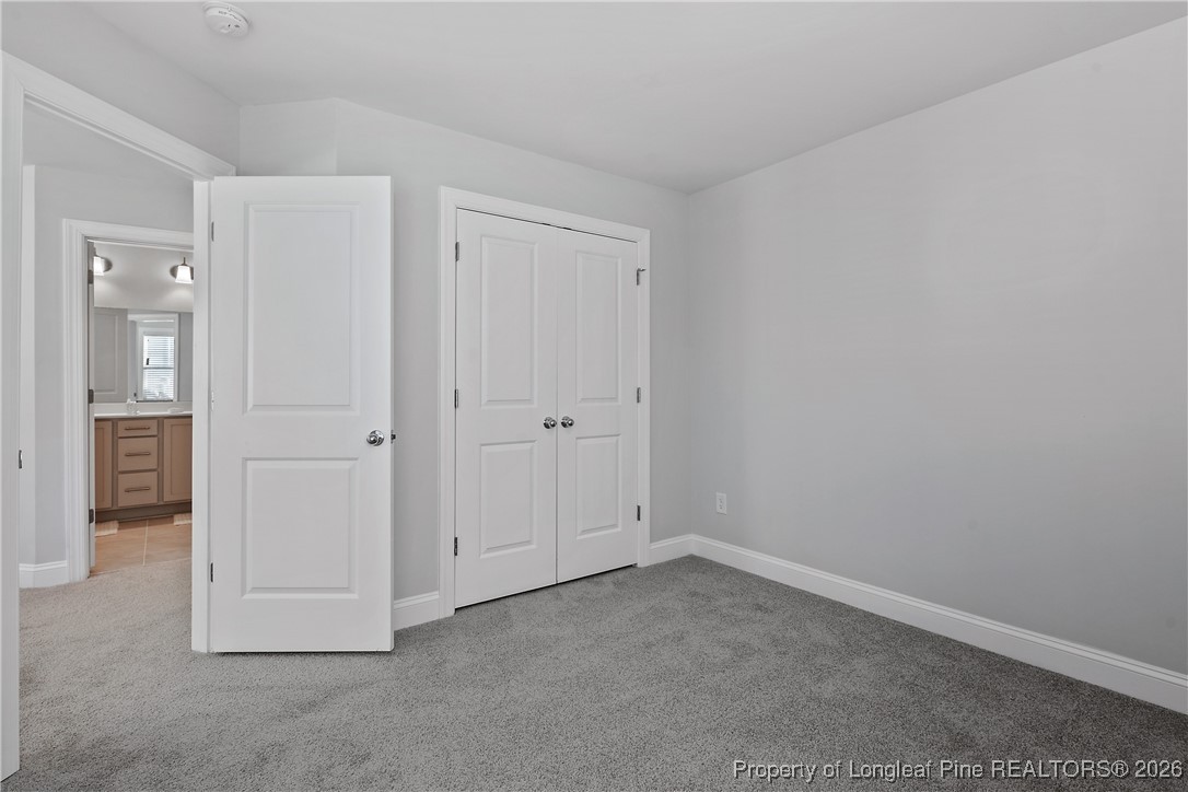 88 Spruce Hollow Circle Spring Lake, NC 28390 - Photo 40 of 48 an empty room with windows