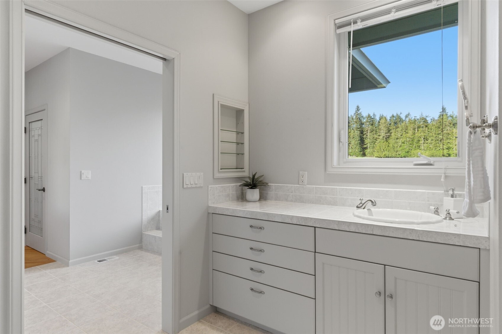 2263 Lost Mountain Road Sequim, WA 98382 - Photo 18 of 40 a bathroom with a sink and a mirror