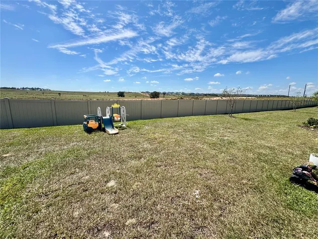a view of a lake with a yard