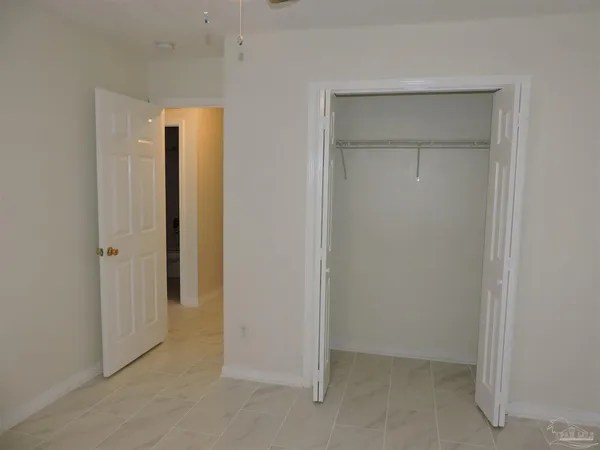 a bathroom with a toilet and a bathtub