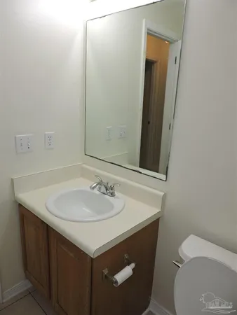 a bathroom with a shower a toilet and a shower