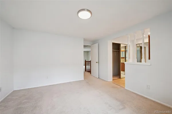a view of a big room with windows and cabinet