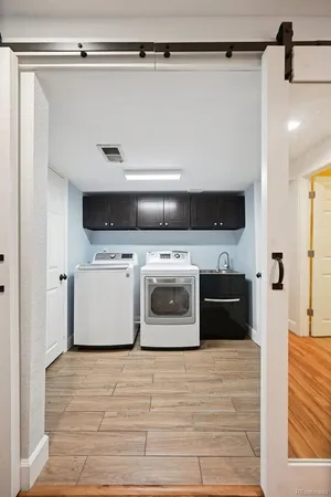a utility room with washer and dryer