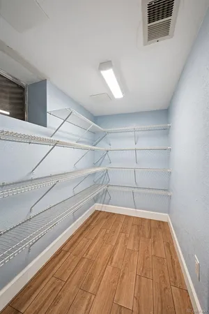 a view of a room with wooden floor and staircase