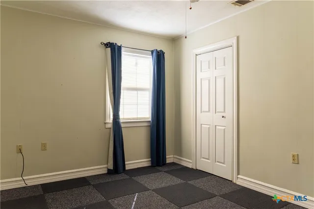 a bathroom with a shower and a sink