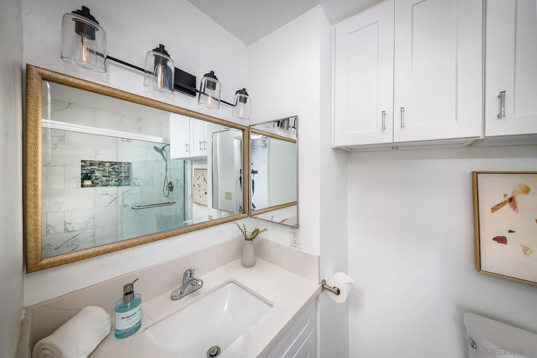 7325 Alicante Road, Unit A Carlsbad, CA 92009 - Photo 13 of 44 a bathroom with a sink and a mirror