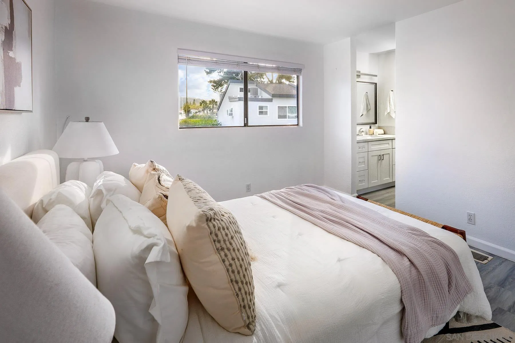 7325 Alicante Road, Unit A Carlsbad, CA 92009 - Photo 16 of 44 a bedroom with a bed and a window