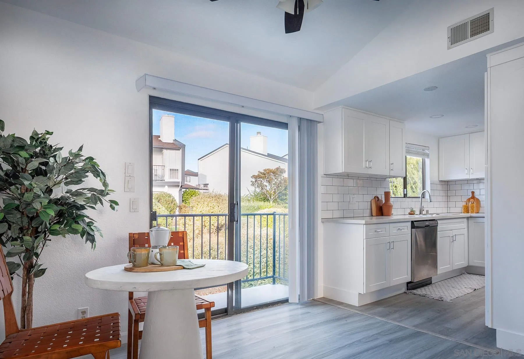 7325 Alicante Road, Unit A Carlsbad, CA 92009 - Photo 18 of 44 a kitchen with a sink a window and chairs