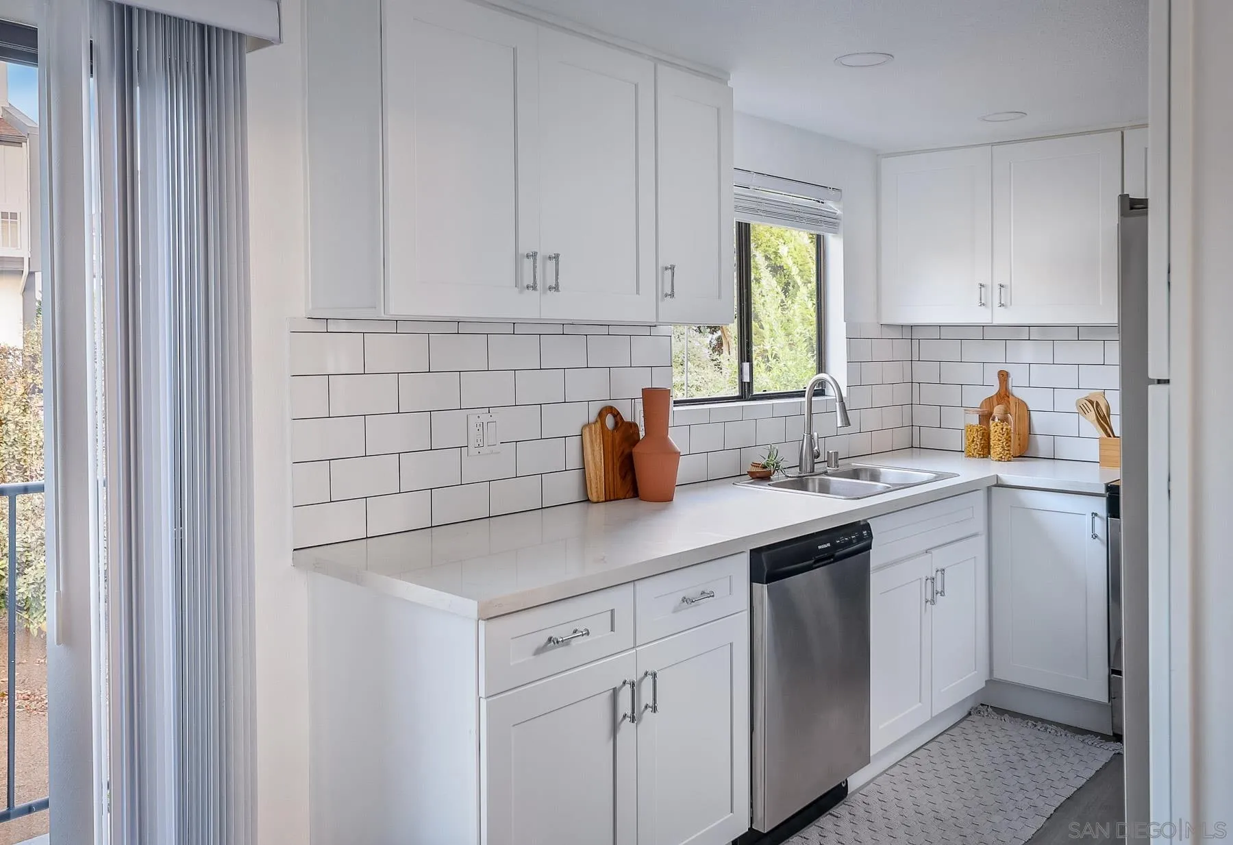 7325 Alicante Road, Unit A Carlsbad, CA 92009 - Photo 19 of 44 a kitchen with a sink cabinets and window