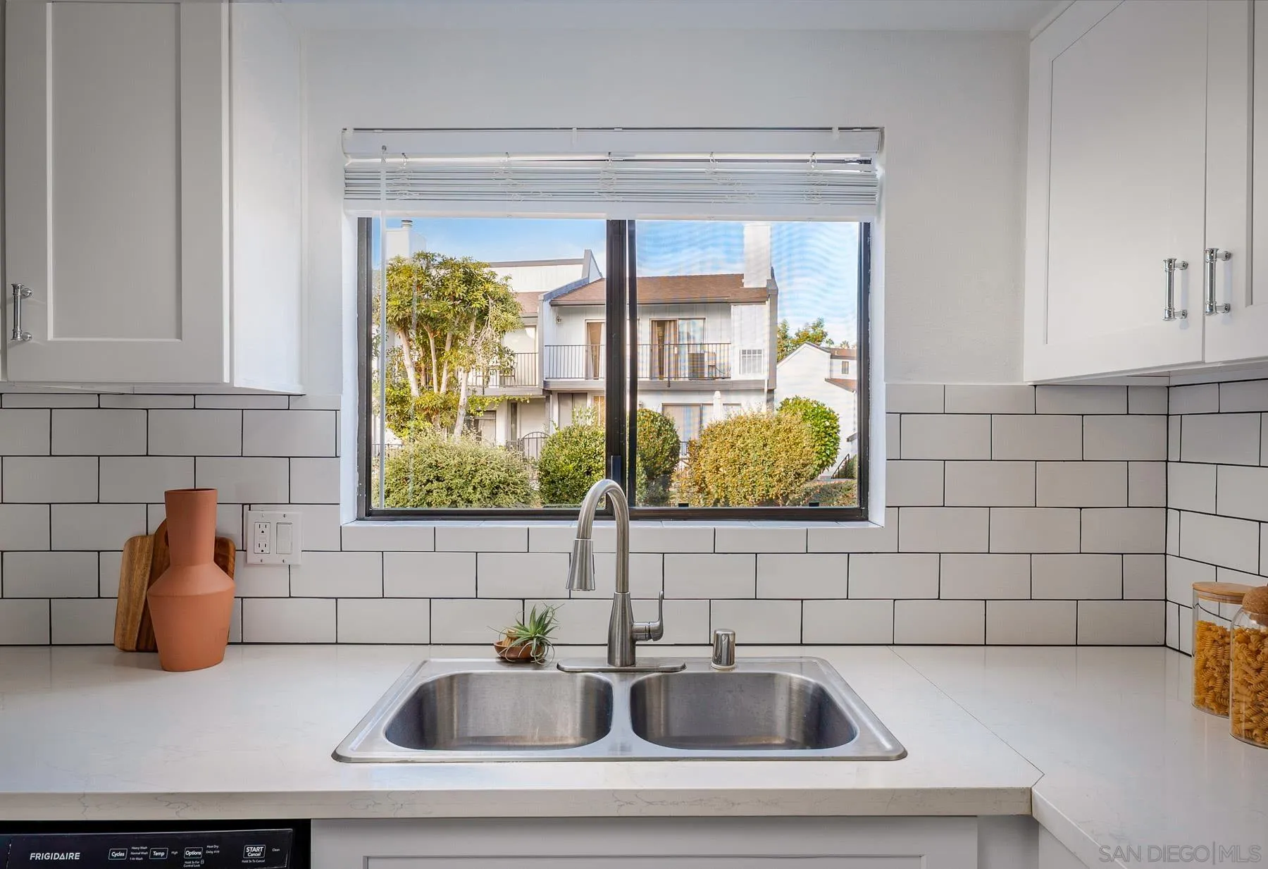 7325 Alicante Road, Unit A Carlsbad, CA 92009 - Photo 21 of 44 a bathroom with a sink and a window