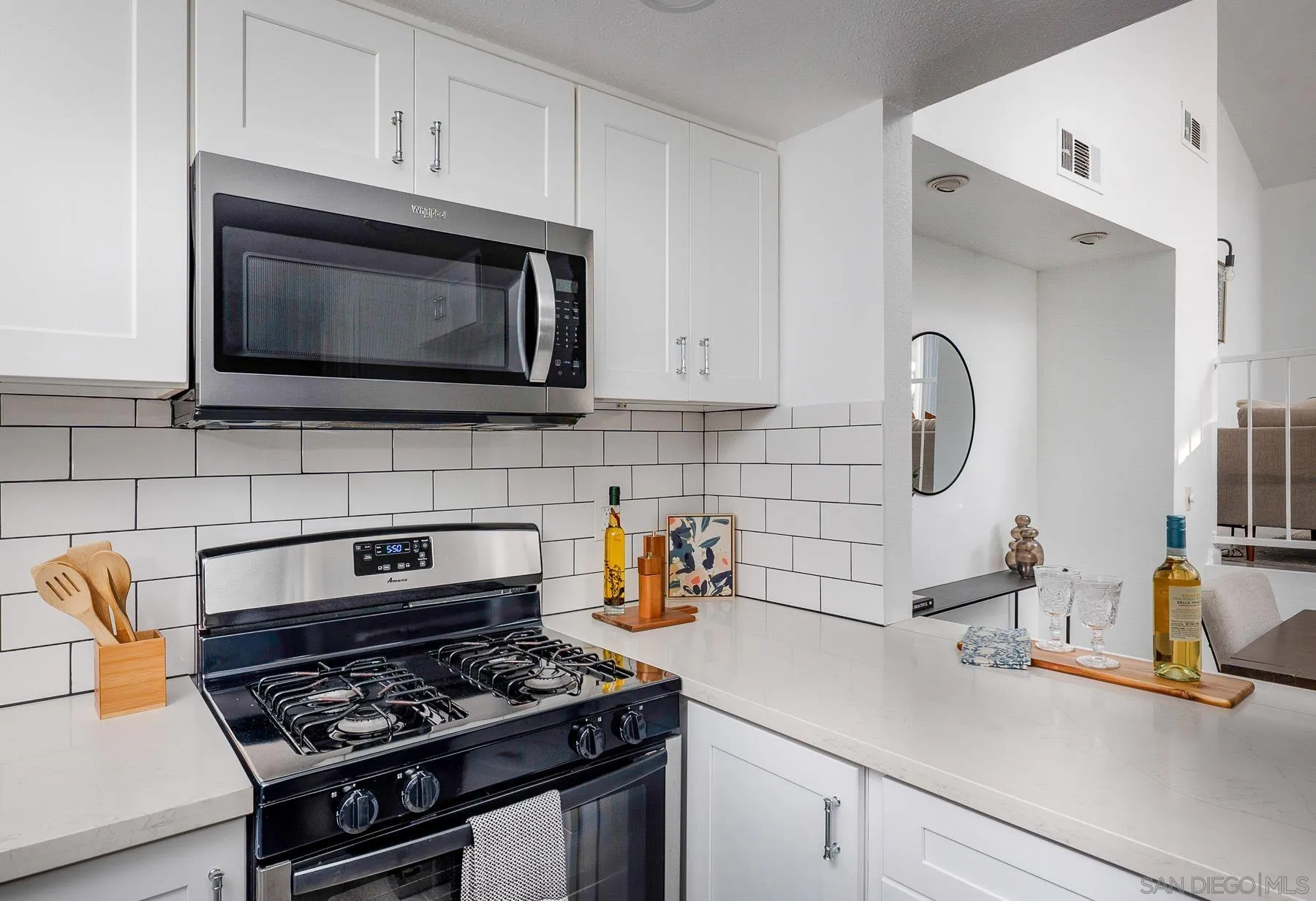 7325 Alicante Road, Unit A Carlsbad, CA 92009 - Photo 23 of 44 a kitchen with a stove and a microwave