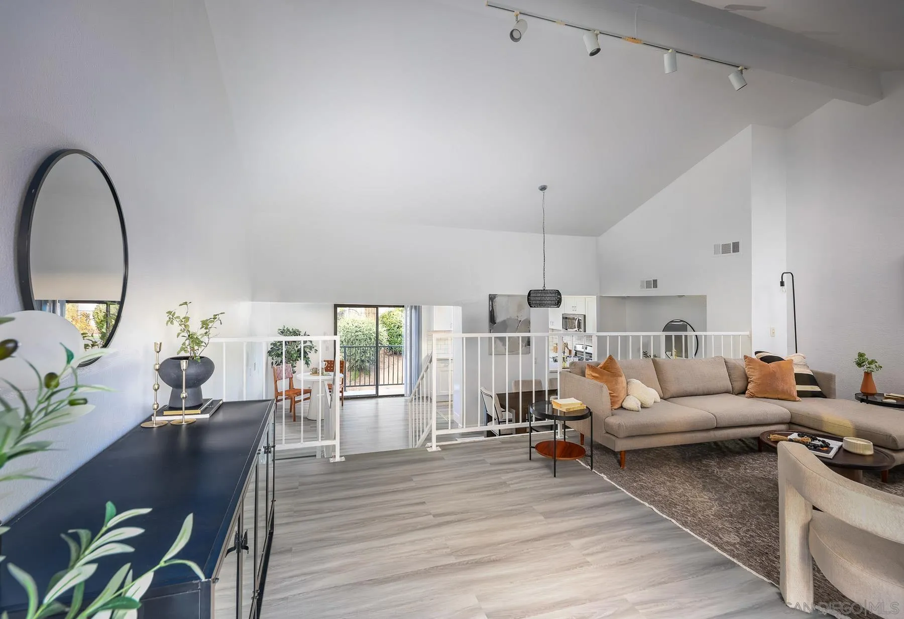 7325 Alicante Road, Unit A Carlsbad, CA 92009 - Photo 28 of 44 a living room with furniture and wooden floor